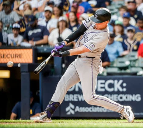 Colorado Rockies pinch hitter TJ Rumfield hits an RBI double in the seventh inning of the MLB, Baseball Herren, USA game between the Colorado Rockies and the Milwaukee Brewers at American Family Field in Milwaukee, Wisconsin on Friday July 24, 2026.  MIL20260724825 TANNENxMAURY