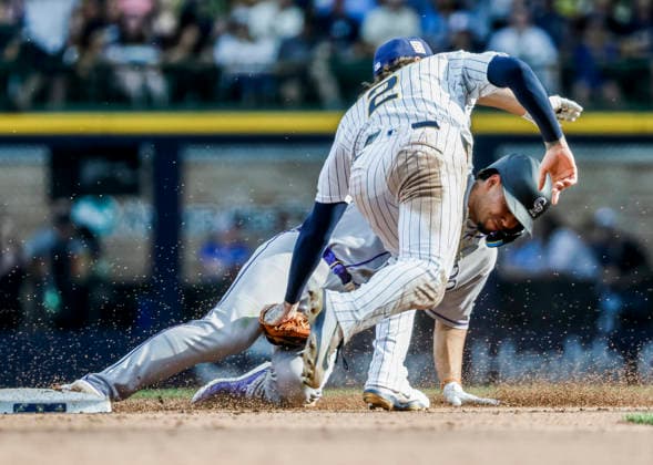 Milwaukee Brewers second baseman Brice Turang tags out Colorado Rockies shortstop Ezequiel Tovar on a steal attempt in the ninth inning of the MLB, Baseball Herren, USA game between the Colorado Rockies and the Milwaukee Brewers at American Family Field in Milwaukee, Wisconsin on Friday July 24, 2026. The Rockies defeated the Brewers 5-2.  MIL20260724831 TANNENxMAURY