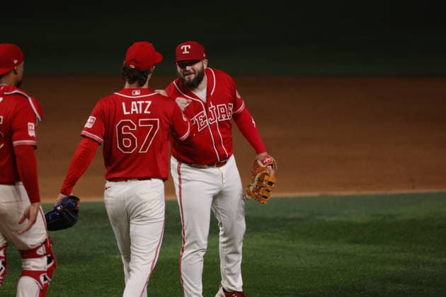July 24, 2026, Arlington, Texas, USA: Texas Rangers first baseman JAKE BURGER (21) congratulates Texas Rangers pitcher JACOB LATZ (67) after a save. Friday, July 24, 2026, in Arlington, Texas. Arlington USA - ZUMAa325 20260724_zsa_a325_001 Copyright: xDavidxBalleringxIix