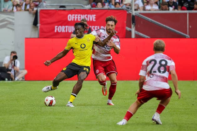 25.07.2026, xgrfx, Fussball Testspiel , Fortuna Düsseldorf - Borussia Dortmund v.l. Joane Gadou (Borussia Dortmund), Fabian Schleusener (Fortuna Düsseldorf) (DFL DFB REGULATIONS PROHIBIT ANY USE OF PHOTOGRAPHS as IMAGE SEQUENCES and or QUASI-VIDEO) Düsseldorf *** July 25, 2026, xgrfx, Soccer Friendly Match, Fortuna Düsseldorf vs. Borussia Dortmund, Joane Gadou (Borussia Dortmund), Fabian Schleusener, Fortuna Düsseldorf; DFL and DFB regulations prohibit any use of photographs as image sequences and or quasi-video; Düsseldorf