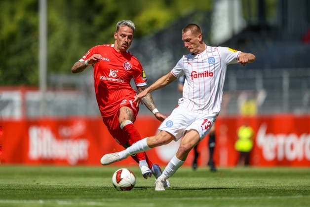 GER, Mainz, FSV Mainz 05 vs Holstein Kiel, Vorbereitung, Fussball, DFB, Spielzeit 2026 2027, Bruchwegstadion auf dem Wolfgang Frank Campus, Testspiel im Bild v.l.: Phillip Tietz (FSV Mainz 05 9), Ivan NekiÄ‡ (Holstein Kiel 13) DFB DFL REGULATIONS PROHIBIT ANY USE OF PHOTOGRAPHS AS IMAGE SEQUENCES AND OR QUASI-VIDEO, 25.07.2026 *** GER, Mainz, FSV Mainz 05 vs. Holstein Kiel, Preseason, Soccer, DFB, 2026–2027 Season, Bruchwegstadion on the Wolfgang Frank Campus, Friendly Match: Pictured from left, Phillip Tietz (FSV Mainz 05) 9, Ivan Nekic, Holstein Kiel 13. DFB and DFL regulations prohibit any use of photographs as image sequences and or quasi-video. July 25, 2026 Copyright: HMBxMedia HendrikxHamelau
