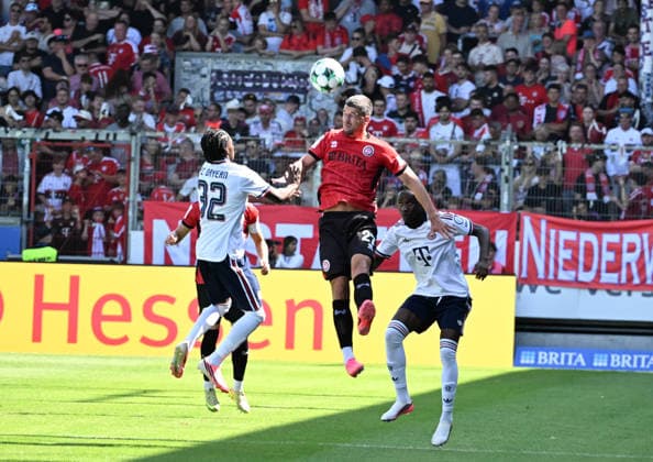25.07.2026, xsltx, Fussball Testspiel, SV Wehen Wiesbaden - FC Bayern München v.l. Oluwaseyi Wilson (FC Bayern München), Jordy Gillekens (SV Wehen Wiesbaden), Richard Ajayi (FC Bayern München) (DFL DFB REGULATIONS PROHIBIT ANY USE OF PHOTOGRAPHS as IMAGE SEQUENCES and or QUASI-VIDEO) *** July 25, 2026, xsltx, Soccer Friendly Match, SV Wehen Wiesbaden vs. FC Bayern Munich: Oluwaseyi Wilson (FC Bayern Munich), Jordy Gillekens (SV Wehen Wiesbaden), Richard Ajayi (FC Bayern Munich). DFL and DFB regulations prohibit any use of photographs as image sequences and or quasi-video.