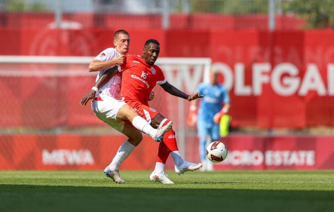GER, Mainz, FSV Mainz 05 vs Holstein Kiel, Vorbereitung, Fussball, DFB, Spielzeit 2026 2027, Bruchwegstadion auf dem Wolfgang Frank Campus, Testspiel im Bild v.l.: Ivan NekiÄ‡ (Holstein Kiel 13), Sheraldo Becker (FSV Mainz 05 23) DFB DFL REGULATIONS PROHIBIT ANY USE OF PHOTOGRAPHS AS IMAGE SEQUENCES AND OR QUASI-VIDEO, 25.07.2026 *** GER, Mainz, FSV Mainz 05 vs. Holstein Kiel, Preseason, Soccer, DFB, 2026–2027 Season, Bruchwegstadion on the Wolfgang Frank Campus, Friendly Match: Pictured from left, Ivan Nekic Holstein Kiel 13, Sheraldo Becker FSV Mainz 05 23 DFB DFL REGULATIONS PROHIBIT ANY USE OF PHOTOGRAPHS AS IMAGE SEQUENCES AND OR QUASI-VIDEO, July 25, 2026 Copyright: HMBxMedia HendrikxHamelau
