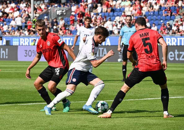 25.07.2026, xsltx, Fussball Testspiel, SV Wehen Wiesbaden - FC Bayern München v.l. Justin Janitzek (SV Wehen Wiesbaden), Tim Binder (FC Bayern München), Niklas May (SV Wehen Wiesbaden) - Binder sorgte in der zweiten Hälfte für mehr Schwung m Bayern-Spiel (DFL DFB REGULATIONS PROHIBIT ANY USE OF PHOTOGRAPHS as IMAGE SEQUENCES and or QUASI-VIDEO) *** July 25, 2026, xsltx, Soccer Friendly Match, SV Wehen Wiesbaden vs. FC Bayern Munich: Justin Janitzek (SV Wehen Wiesbaden), Tim Binder (FC Bayern Munich), Niklas May, SV Wehen Wiesbaden. Binder brought more momentum to Bayern’s game in the second half. DFL DFB REGULATIONS PROHIBIT ANY USE OF PHOTOGRAPHS AS IMAGE SEQUENCES AND OR QUASI-VIDEO