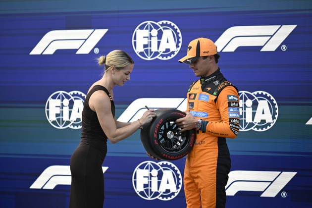 July 25, 2026, Budapest, Budapest, Hungary: Lando Norris receives the Pirelli Pole award from Michelle Gulyas, Hungarian Olympian after the qualifying session of the 2026 Hungarian Grand Prix in Budapest, Hungary on 25 July 2026. Budapest Hungary - ZUMAs291 20260725_zip_s291_057 Copyright: xBalintxSzentgallayx