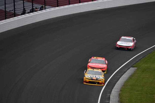 INDIANAPOLIS, IN - JULY 25: Carson Kvapil ( 1 JR Motorsports Wilde Protein Crackers Chevrolet) races through turn one ahead of Justin Allgaier ( 7 JR Motorsports BRANDT Professional Agriculture Chevrolet) and Sheldon Creed ( 00 Haas Factory Team Road Ranger Chevrolet) during the NASCAR, Motorsport, USA OÕReilly Auto Parts Series Pennzoil 250 on July 25, 2026, at Indianapolis Motor Speedway in Indianapolis, Indiana. (Photo by Michael Allio Icon Sportswire) AUTO: JUL 25 NASCAR OÕReilly Auto Parts Series Pennzoil 250 EDITORIAL USE ONLY Icon116260725018250