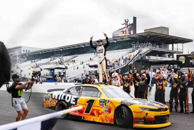 July 25, 2026, Speedway, Indianapolis, USA: CARSON KVAPIL, driver of the No. 1 Chevrolet for JR Motorsports, celebrates on top of his car on the frontstretch after winning the Pennzoil 250 race at the Indianapolis Motor Speedway. Speedway USA - ZUMAw173 20260725_zsp_w173_003 Copyright: xLukexWelshx