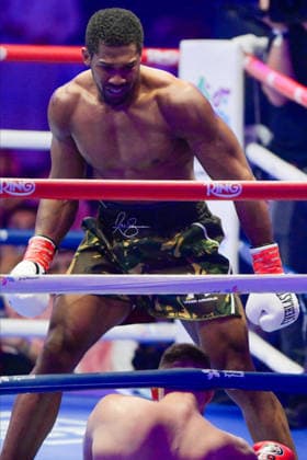JEDDAH, SAUDI ARABIA - JULY 25: Anthony Joshua (army camouflage shorts) looks down at Kristian Prenga (bottom of picture) during the Heavyweight contest fight between Anthony Joshua and Kristian Prenga in the Anthony Joshua v Kristian Prenga: The Comeback fight night at Jeddah Superdome on July 25, 2026 in Jeddah, Saudi Arabia.  Copyright: xKhalidxAlhaj MBxMediax
