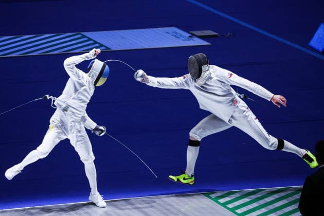 CHINA, HONG KONG - JULY 26, 2026: Ukraine s Roman Svichkar (L) and Russia s Dmitry Shvelidze compete in the men s individual epee event at the 2026 Kerry Fencing World Championships. Mikhail Sinitsyn TASS  95477723