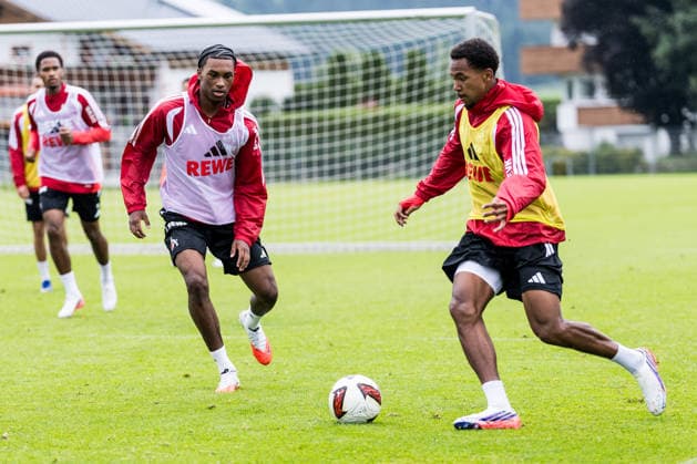 ST. JOHANN IN TIROL, AUSTRIA - JULY 26: Youssoupha Niang (1. FC Koeln, 38) controls the ball against Reigan Heskey (1. FC Koeln, 11) during a training session at trainings camp in Kitzbuehel of season 2026 27 at Koasastadion on July 26, 2026 in St. Johann in Tirol, Austria. Austria Copyright: xSteffiexWunderlx