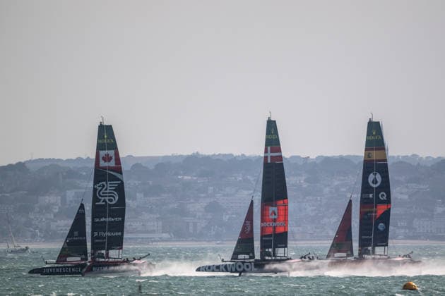 Canada Sail GP with Giles Scott as driver lead Rockwool Denmark led by round the world sailor Nicolai Sehested and Spain lead by driver Diego Botin and wing trimmer Florian Trittel at the start during the Emirates GB SailGP at The Solent, Portsmouth, UK on 25 July 2026. Copyright: xPhilxHutchinsonx 45300041