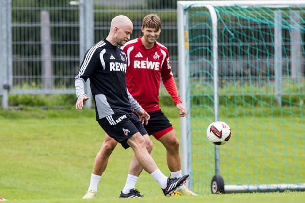 ST. JOHANN IN TIROL, AUSTRIA - JULY 26: Rene Wagner (Head Coach 1. FC Koeln) controls the ball against Joel Schmied (1. FC Koeln, 2) during a training session at trainings camp in Kitzbuehel of season 2026 27 at Koasastadion on July 26, 2026 in St. Johann in Tirol, Austria. Austria Copyright: xSteffiexWunderlx
