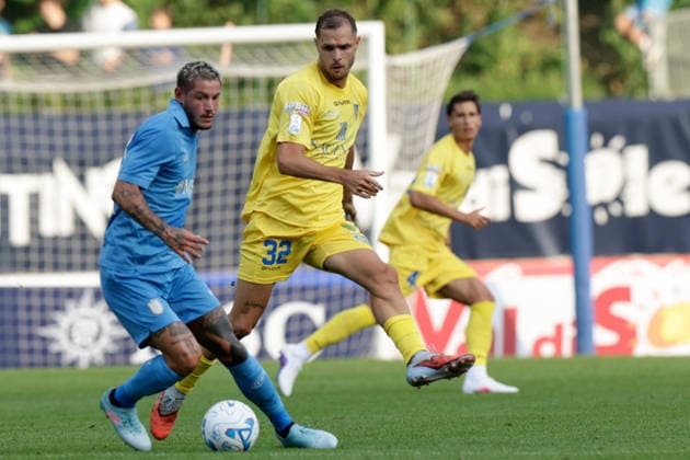 SOCCER - Friendly Match - Napoli vs. Carrarese Photo by IPA ABACAPRESS.COM87021819 - Napoli s Italian defender Pasquale Mazzocchi challenges Mattia Finotto for the ball during a friendly match between SSC Napoli and Carrarese at SSC Napoli s 2026-27 preseason training camp in Val di Sole, Trentino, Dimaro Folgarida, on July 26, 2026. Dimaro Italy  Copyright: xIPAxSport ABACAx