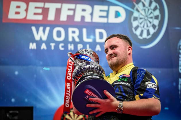 RECORD DATE NOT STATED 26th July 2026, Winter Gardens, Blackpool, Lancashire, England; 2026 Betfred World Matchplay Darts, Mens, Final Day; Luke Littler celebrates winning his final match against Gerwyn Price and holds the Betfred World Matchplay trophy GodfreyxPitt