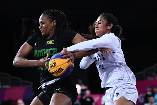 COM26 3X3 BASKETBALL, Estelle Kainamoli of Fiji (right) competes with Christian Bryan of Jamaica during the 3X3 Basketball Pool Round match against Jamaica at SEC Centre Hall 4 during the Glasgow 2026 Commonwealth Games in Glasgow, Scotland, Sunday, July 26, 2026. ( NO ARCHIVING, EDITORIAL USE ONLY Glasgow Scotland United Kingdom  Copyright: xJOELxCARRETTx 20260727117751971058
