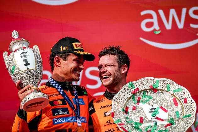 (260727) -- MOGYOROD, July 27, 2026 -- McLaren s Lando Norris of Britain (L) celebrates with a teammate during the awarding ceremony after the Formula One Hungarian Grand Prix at the Hungaroring in Mogyorod, near Budapest, Hungary, July 26, 2026. (Photo by Xinhua) (SP)HUNGARY-MOGYOROD-F1-HUNGARIAN GRAND PRIX-RACE DavidxBalogh 