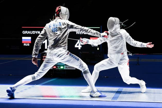 CHINA, HONG KONG - JULY 27, 2026: Russia s Pavel Graudyn (L) and China s Wei Zhenhao compete in the men s individual sabre event at the 2026 Kerry Fencing World Championships. Mikhail Sinitsyn TASS  95533392