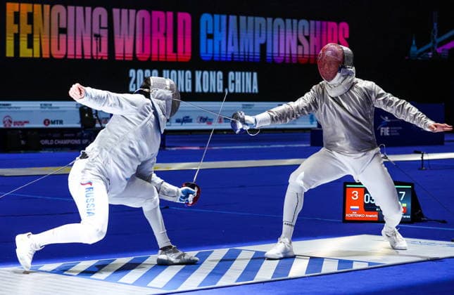 CHINA, HONG KONG - JULY 27, 2026: Russia s Anatoly Kostenko (L) and Tunisia s Fares Ferjani compete in the men s individual sabre event at the 2026 Kerry Fencing World Championships. Mikhail Sinitsyn TASS  95533917