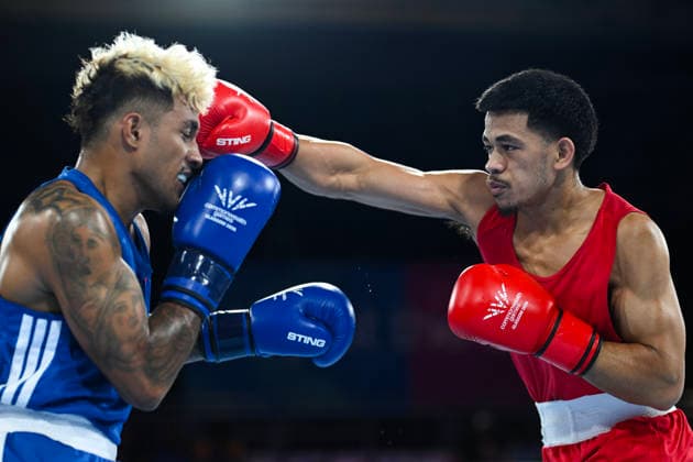 COM26 BOXING, Marion Ah Tong of Samoa (red) fights Tavita Kaoma of Kiribati during the Men™s 70kg Round of 16 match of the Glasgow 2026 Commonwealth Games at SEC Centre in Glasgow, Scotland, Monday, July 27, 2026. ( NO ARCHIVING, EDITORIAL USE ONLY Glasgow Scotland United Kingdom  Copyright: xLUKASxCOCHx 20260728114138459876