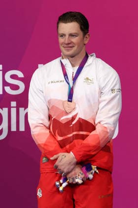 July 27, 2026, Glasgow, Scotland, Great Britain: ADAM RAMSAY-PEATY of England poses with the bronze medal during the Swimming Men s 50m Breaststroke Medal Ceremony of the Commonwealth Games Glasgow 2026 at the Tollcross International Swimming Centre in Glasgow, Scotland. Glasgow Great Britain - ZUMAc179 20260727_zep_c179_504 Copyright: xMickaelxChavetx