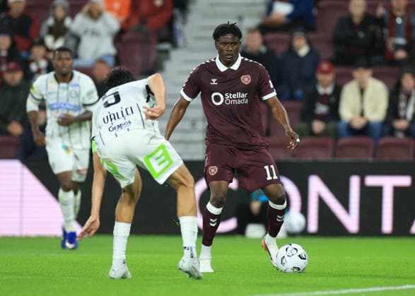 Heart of Midlothian v SK Sturm Graz UEFA Champions League Pierre Landry KaborŽ of Heart of Midlothian drives forward with the ball towards Albert Vallci of SK Sturm Graz (left) during the UEFA Champions League Second Qualifying Round Second Leg match at Tynecastle Park, Edinburgh 28 07 2026 UK Newspapers OUT Copyright: xFredxPalmerx FIL-23686-0085
