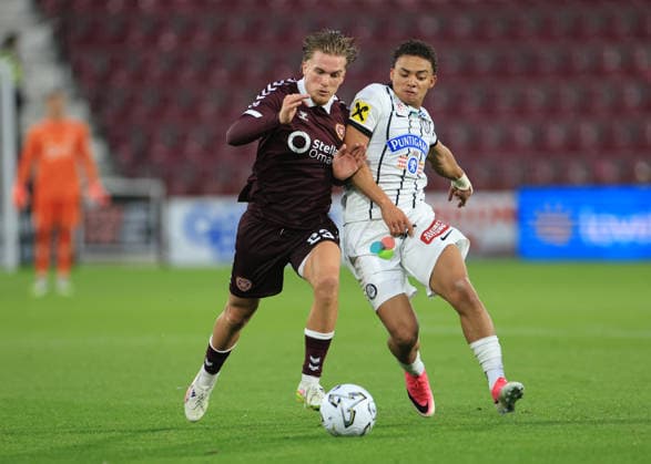 Heart of Midlothian v SK Sturm Graz UEFA Champions League Jordi Altena of Heart of Midlothian (left) shields the ball from Jacob Peter Hödl of SK Sturm Graz during the UEFA Champions League Second Qualifying Round Second Leg match at Tynecastle Park, Edinburgh 28 07 2026 UK Newspapers OUT Copyright: xFredxPalmerx FIL-23686-0101