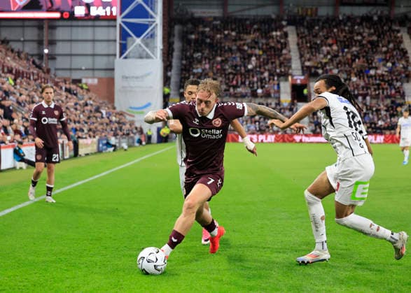 Heart of Midlothian v SK Sturm Graz UEFA Champions League Calvin Miller of Heart of Midlothian crosses the ball under pressure from Emran Soglo of SK Sturm Graz during the UEFA Champions League Second Qualifying Round Second Leg match at Tynecastle Park, Edinburgh 28 07 2026 UK Newspapers OUT Copyright: xFredxPalmerx FIL-23686-0106