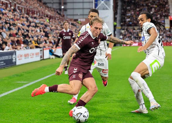 Heart of Midlothian v SK Sturm Graz UEFA Champions League Calvin Miller of Heart of Midlothian crosses the ball under pressure from Emran Soglo of SK Sturm Graz during the UEFA Champions League Second Qualifying Round Second Leg match at Tynecastle Park, Edinburgh 28 07 2026 UK Newspapers OUT Copyright: xFredxPalmerx FIL-23686-0108