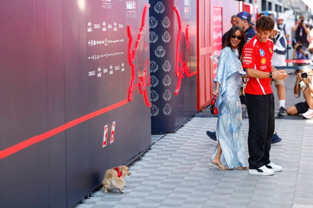 Budapest: F1 GP Hungary 2026 on July, 24, 2026, (Photo by Hoch Zwei), 16 LECLERC Charles (mco), Scuderia Ferrari mit Frau Alexandra Leclerc (Alexandra Saint Mleux) und Hund der vor der Red Bull Garage sein Geschäft macht, wife dog, Budapest Hungary *** 2026 Hungarian F1 Grand Prix in Budapest on July 24, 2026; Photo by Hoch Zwei, 16 LECLERC Charles mco, Scuderia Ferrari with his wife Alexandra Leclerc (Alexandra Saint Mleux) and their dog doing its business in front of the Red Bull garage; wife, dog, Budapest, Hungary