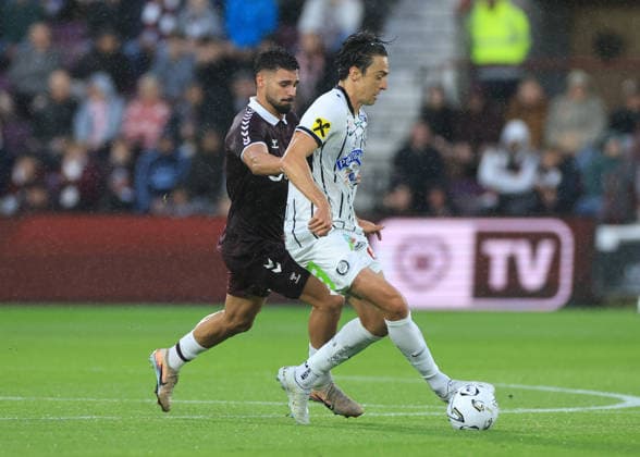 Heart of Midlothian v SK Sturm Graz UEFA Champions League Cl‡udio Braga of Heart of Midlothian (left) competes for the ball with Albert Vallci of SK Sturm Graz during the UEFA Champions League Second Qualifying Round Second Leg match at Tynecastle Park, Edinburgh 28 07 2026 UK Newspapers OUT Copyright: xFredxPalmerx FIL-23686-0119