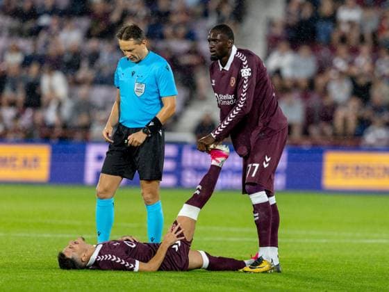 Amadou Ba-Sy of Heart of Midlothian helps Alexandros Kyziridis of Heart of Midlothian with cramp during the Hearts v Sturm Graz second leg of their Champions League second qualifying round at Tynecastle Stadium on Tuesday 28th July 2026 Heart of Midlothian v Sturm Graz, UEFA Champions League, 2nd Qualifying Round, 2nd Leg, Football, Tynecastle Park, Edinburgh, Scotland, UK - 28 Jul 2026Edinburgh Tynecastle Park Scotland United Kingdom  Copyright: xAlanxRennie Shutterstockx 17015998fo