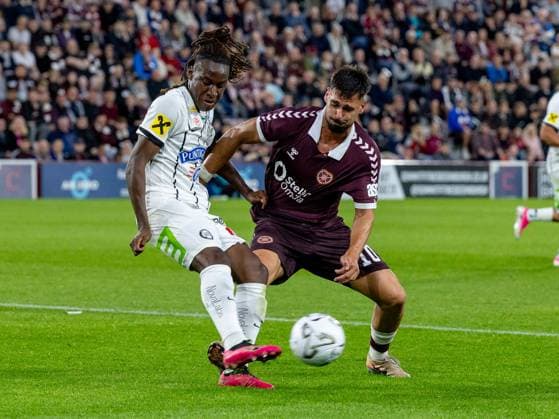 Emran Soglo, of SK Sturm Graz and Claudio Braga of Heart of Midlothian compete for possession of the ball during the Hearts v Sturm Graz second leg of their Champions League second qualifying round at Tynecastle Stadium on Tuesday 28th July 2026 Heart of Midlothian v Sturm Graz, UEFA Champions League, 2nd Qualifying Round, 2nd Leg, Football, Tynecastle Park, Edinburgh, Scotland, UK - 28 Jul 2026Edinburgh Tynecastle Park Scotland United Kingdom  Copyright: xAlanxRennie Shutterstockx 17015998fq