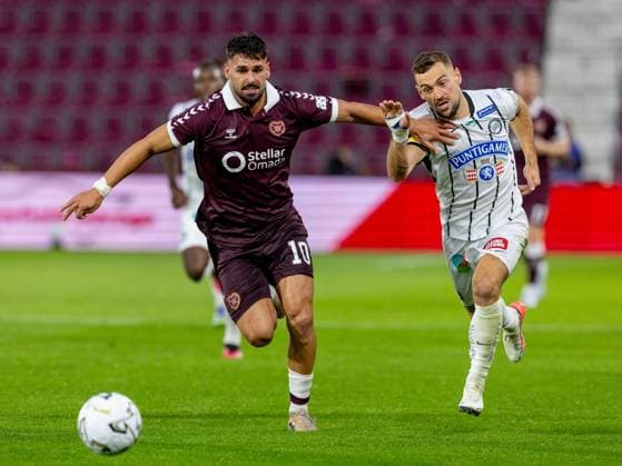 Claudio Braga of Heart of Midlothian and Jürgen Heil, of SK Sturm Graz compete for possession of the ball during the Hearts v Sturm Graz second leg of their Champions League second qualifying round at Tynecastle Stadium on Tuesday 28th July 2026 Heart of Midlothian v Sturm Graz, UEFA Champions League, 2nd Qualifying Round, 2nd Leg, Football, Tynecastle Park, Edinburgh, Scotland, UK - 28 Jul 2026Edinburgh Tynecastle Park Scotland United Kingdom  Copyright: xAlanxRennie Shutterstockx 17015998gb