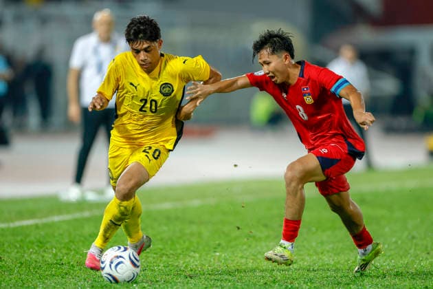 July 28, 2026, Kuala Lumpur, Malaysia: Muhammad Syafiq Bin Ahmad of Malaysia (L) and Damoth Thongkhamsavath of Laosseen seen in action during the ASEAN Hyundai Cup 2026 match between Malaysia and Laos at Kuala Lumpur Football Stadium, Cheras. Final score; Malaysia 4:0 Laos. ASEAN Hyundai Cup 2026 Malaysia Vs Laos In Kuala Lumpur, Malaysia - 28 Jul 2026  - ZUMAs197 20260728_aaa_s197_302 Copyright: xWongxFokxLoyx