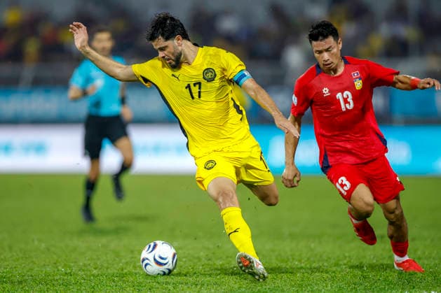 July 28, 2026, Kuala Lumpur, Malaysia: Sturmer Dos Reis Paulo Josue of Malaysia (L) and Viengxay Sidavong of Laos seen in action during the ASEAN Hyundai Cup 2026 match between Malaysia and Laos at Kuala Lumpur Football Stadium, Cheras. Final score; Malaysia 4:0 Laos. Kuala Lumpur Malaysia - ZUMAs197 20260728_aaa_s197_306 Copyright: xWongxFokxLoyx