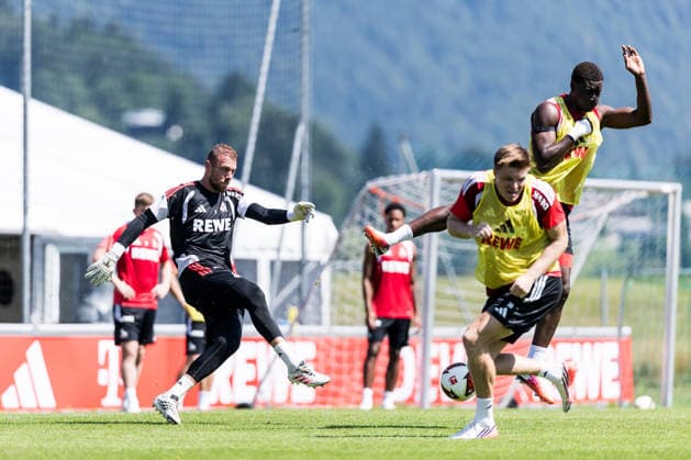ST. JOHANN IN TIROL, AUSTRIA - JULY 29: Marvin Schwaebe (Schwäbe, Schwabe, 1. FC Koeln, 1) shooting the ball, hitting Ragnar Ache (1. FC Koeln, 9) during a training session at trainings camp in Kitzbuehel of season 2026 27 at Koasastadion on July 29, 2026 in St. Johann in Tirol, Austria. Austria Copyright: xSteffiexWunderlx