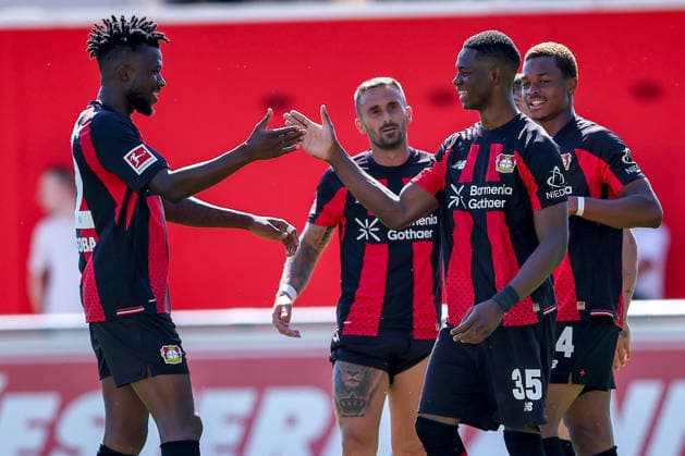 29.07.2026, Fußball, Bayer 04 Leverkusen - KRC Genk, Testspiel, Saison 2026 2027 im Ulrich-Haberland-Stadion: Torjubel nach dem Tor zum 4:0 durch Torschütze Christian Kofane (Bayer04 Leverkusen 35) zusammen mit Edmond Tapsoba (Bayer04 Leverkusen 12) Jeanuel Belocian (Bayer04 Leverkusen 44) DFB regulations prohibit any use of photographs as image sequences and or quasi-video. Nordrhein-Westfalen Deutschland *** July 29, 2026, Soccer, Bayer 04 Leverkusen vs. KRC Genk, Friendly Match, 2026–2027 season at Ulrich Haberland Stadium; celebration after the 4–0 goal scored by Christian Kofane (Bayer 04 Leverkusen 35), together with Edmond Tapsoba (Bayer 04 Leverkusen 12) and Jeanuel Belocian (Bayer 04 Leverkusen 44); DFB regulations prohibit any use of photographs as image sequences and or quasi-video. North Rhine-Westphalia, Germany