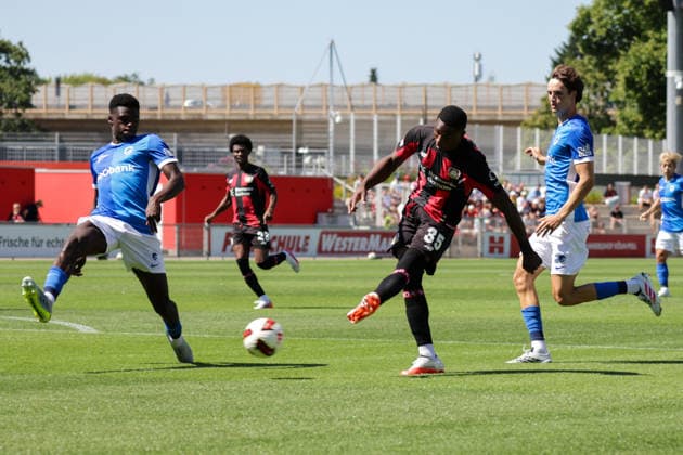 29.07.2026, xgrfx, Fussball Testspiel, Bayer 04 Leverkusen - KRC Genk v.l. Josue Kongolo (KRC Genk), Christian Kofane (Bayer Leverkusen) (DFL DFB REGULATIONS PROHIBIT ANY USE OF PHOTOGRAPHS as IMAGE SEQUENCES and or QUASI-VIDEO) Leverkusen *** July 29, 2026, xgrfx, Soccer Friendly Match, Bayer 04 Leverkusen vs. KRC Genk, featuring Josue Kongolo (KRC Genk) and Christian Kofane (Bayer Leverkusen). DFL and DFB regulations prohibit any use of photographs as image sequences and or quasi-video. Leverkusen