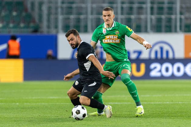 SOCCER - UEFA ECL, Rapid vs Coloma VIENNA,AUSTRIA,29.JUL.26 - SOCCER - UEFA Conference League, qualification, SK Rapid Wien vs FC Santa Coloma. Image shows Guillaume Lopez (Coloma) aand Nenad Cvetkovic (Rapid).  GEPAxpictures xPhilippxBrem