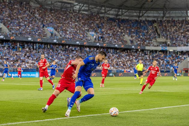 Aleksandre Amisulashvili of Iberia 1999 Tbilisi and Mykola Kukharevych of SK Slovan Bratislava seen during UEFA Champions league second qualifying round game between teams of SK Slovan Bratislava and Iberia 1999 Tbilisi (Dominika Kortvelyesiova Ball Raw Images) Bratislava Tehelne Pole stadium Slovakia Copyright: xDominikaxKortvelyesiovax DKOR8544