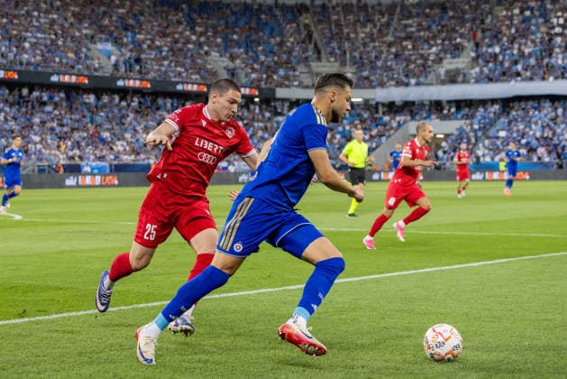 Aleksandre Amisulashvili of Iberia 1999 Tbilisi and Mykola Kukharevych of SK Slovan Bratislava seen during UEFA Champions league second qualifying round game between teams of SK Slovan Bratislava and Iberia 1999 Tbilisi (Dominika Kortvelyesiova Ball Raw Images) Bratislava Tehelne Pole stadium Slovakia Copyright: xDominikaxKortvelyesiovax DKOR8546