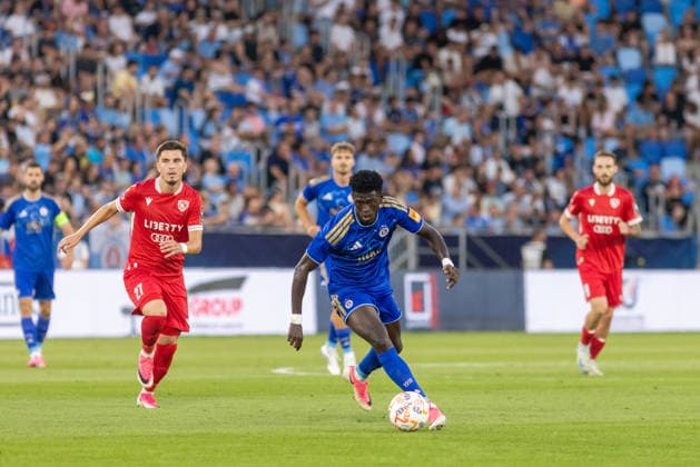 Giorgi Kutsia of Iberia 1999 Tbilisi and Alasana Yirajang of SK Slovan Bratislava seen during UEFA Champions league second qualifying round game between teams of SK Slovan Bratislava and Iberia 1999 Tbilisi (Dominika Kortvelyesiova Ball Raw Images) Bratislava Tehelne Pole stadium Slovakia Copyright: xDominikaxKortvelyesiovax DKR_1063