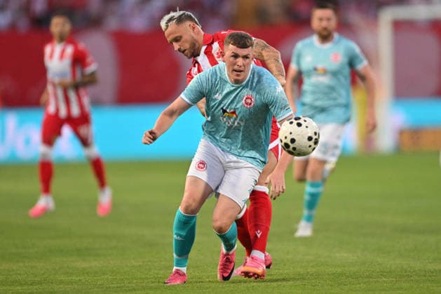 CRVENA ZVEZDA vs LARNE NORTHERN IRLAND AARON DONNELLY vs MARKO ARNAUTOVIC football Crvena zvezda vs Larne Northern Irland during UEFA Champions league qualification match at Rajko Mitic stadium, Belgrade 29.07.2026 Foto: FOOTBALL, CRVENA ZVEZDA, RED STAR, UEFA CHAMPIONS LEAGUE QUALIFICATIONS, LARNE NORTHERN IRLAND Belgrade Rajko Mitic stadium Serbia Copyright: xMarkoxMetlasx xMNxPressx
