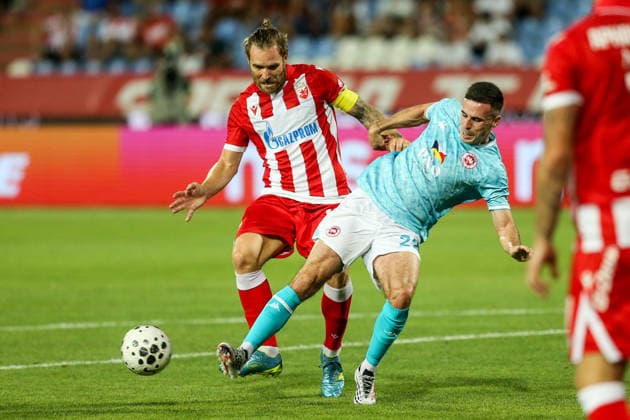 Red Star Belgrade v Larne - UEFA Champions League Qualifying BELGRADE, SERBIA - JULY 29: Aaron McEneff (22) of Larne in action against Aleksandar Katai (L) of Red Star Belgrade during the Champions League second qualifying round second leg between Red Star Belgrade and Larne at Red Star Stadium in Belgrade, Serbia, on July 29, 2026. Filip Stevanovic Anadolu Belgrade Serbia. Editorial use only. Please get in touch for any other usage.  Copyright: x2026xAnadoluxFilipxStevanovicx
