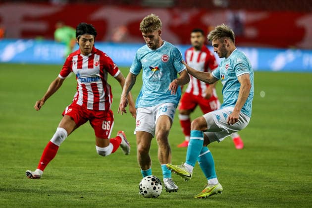 Red Star Belgrade v Larne - UEFA Champions League Qualifying BELGRADE, SERBIA - JULY 29: Dylan Sloan (25) of Larne in action against Seol Young-Woo (66) of Red Star Belgrade during the Champions League second qualifying round second leg between Red Star Belgrade and Larne at Red Star Stadium in Belgrade, Serbia, on July 29, 2026. Filip Stevanovic Anadolu Belgrade Serbia. Editorial use only. Please get in touch for any other usage.  Copyright: x2026xAnadoluxFilipxStevanovicx