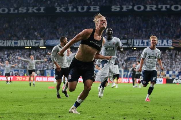 Tobias Bech of Aarhus GF celebrates after scoring the winning goal in the penalty shootout with teammates after qualifying for the UEFA Champions League Third Round Lech Poznan v Aarhus GF, UEFA Champions League Second Round Qualifier Second Leg, Football, Enea Stadion, Poznan, Poland, 29 07 2026 - 29 Jul 2026Poznan ENEA Stadion Poland  Copyright: xHanc WiredxPhotos Shutterstockx 17026455o