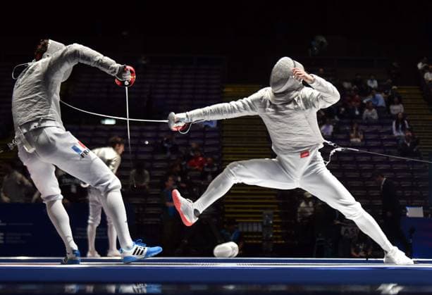 (260730) -- HONG KONG, July 30, 2026 -- Lin Xiao (R) of China competes with Remi Garrigue of France during the team men s sabre quarterfinal match between China and France at the 2026 Fencing World Championships in Hong Kong, south China, July 30, 2026. ) (SP)CHINA-HONG KONG-FENCING-WORLD CHAMPIONSHIPS-MEN S SABRE-TEAM (CN) LoxPingxFai 