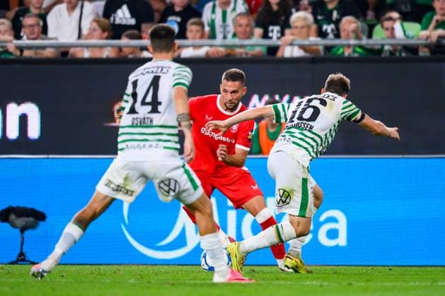 Budapest , 30-07-2026 , Groupama Arena , season 2026 2027 , UEFA Europa League play-off football , match between Ferencvarosi TC and FC Twente , picture shows Ferencvarosi player Attila Osvath FC Twente player Marko Pjaca Ferencvarosi player Kristoffer Zachariassen Ferencvarosi - Twente  x205337012x Copyright: