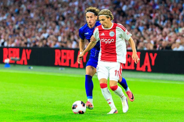 AFC Ajax v FK Vojvodina - UEFA Conference League AMSTERDAM, NETHERLANDS - JULY 30: Mika Godts of AFC Ajax and Djordje Crnomarkovic of FK Vojvodina during the UEFA Conference League match between AFC Ajax and FK Vojvodina at Johan Cruijff Arena on July 30, 2026 in Amsterdam, Netherlands. Amsterdam Johan Cruijff Arena Netherlands Content not available for redistribution in The Netherlands directly or indirectly through any third parties. Copyright: xMarcelxvanxPlateringenx