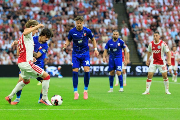 AFC Ajax v FK Vojvodina - UEFA Conference League AMSTERDAM, NETHERLANDS - JULY 30: Mika Godts of AFC Ajax and Djordje Crnomarkovic of FK Vojvodina during the UEFA Conference League match between AFC Ajax and FK Vojvodina at Johan Cruijff Arena on July 30, 2026 in Amsterdam, Netherlands. Amsterdam Johan Cruijff Arena Netherlands Content not available for redistribution in The Netherlands directly or indirectly through any third parties. Copyright: xMarcelxvanxPlateringenx